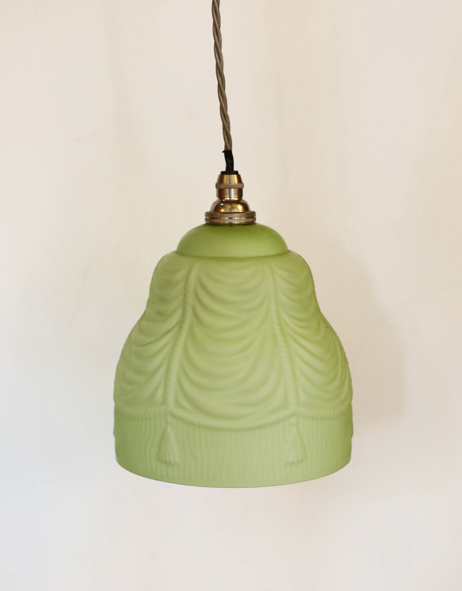 A pair of 1930s frosted green paint glass lampshades with pendant fittings, height 19cm, width 15cm